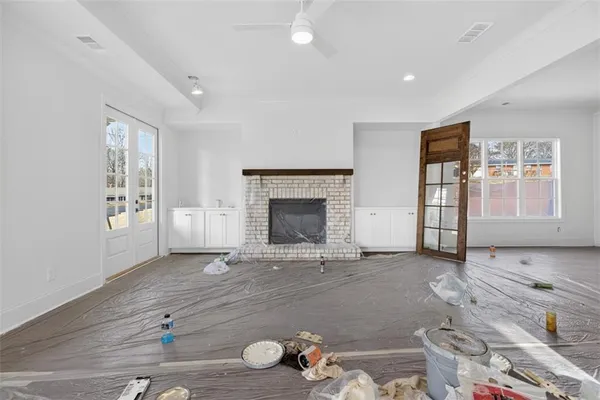 a view of a kitchen with a sink stainless steel appliances and cabinets