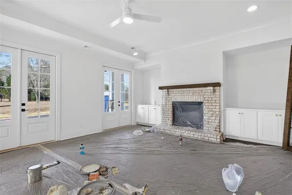 a view of a kitchen with microwave and cabinets