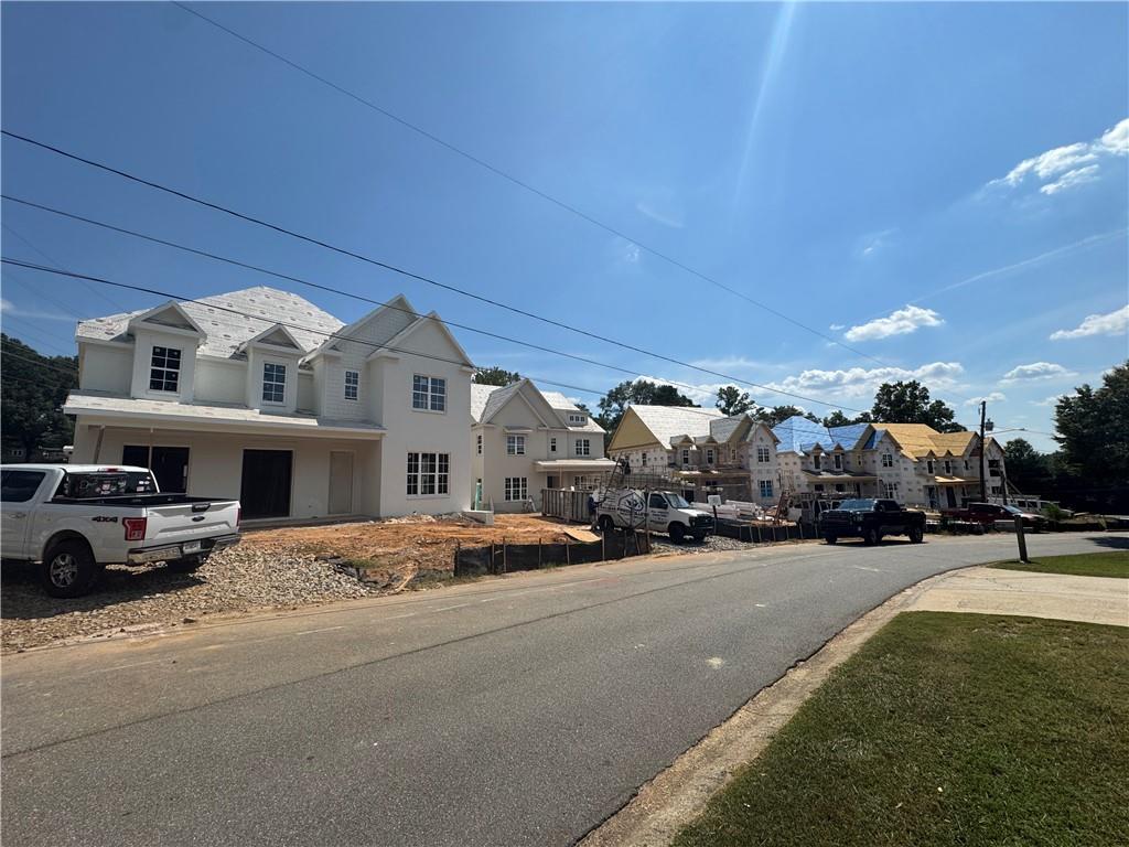 212 Suwanee Avenue Northeast Suwanee, GA 30024 - Photo 13 of 14 a view of building with cars parked in front of it