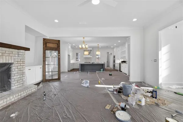 a kitchen with cabinets and wooden floor
