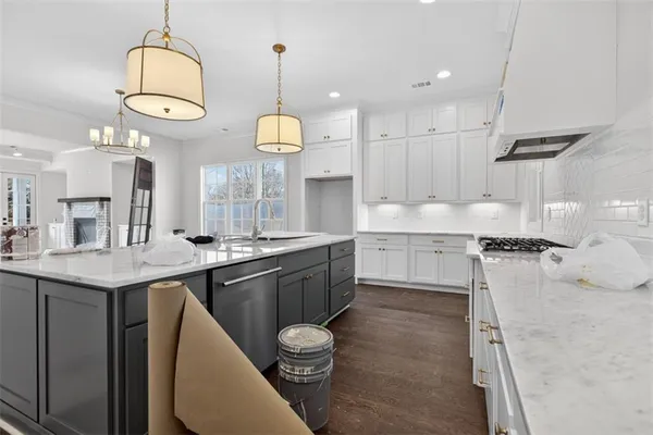 a bathroom with double vanity and a mirror