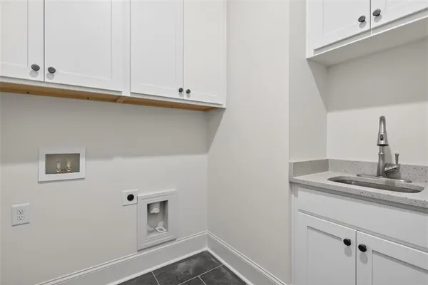 a spacious bathroom with a granite countertop sink a mirror and shower