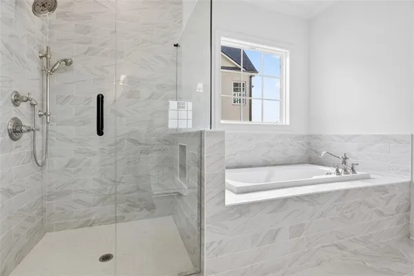 an empty room with a window and a ceiling fan