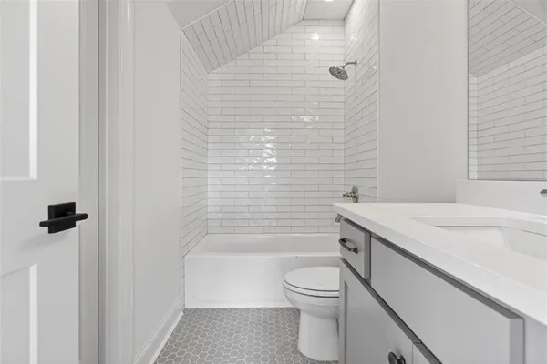 an empty room with a chandelier fan