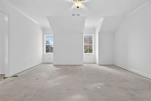 a white bath tub sitting next to a white toilet
