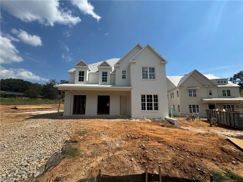 212 Suwanee Avenue Northeast Suwanee, GA 30024 - Photo 5 of 14 a front view of a house with a yard