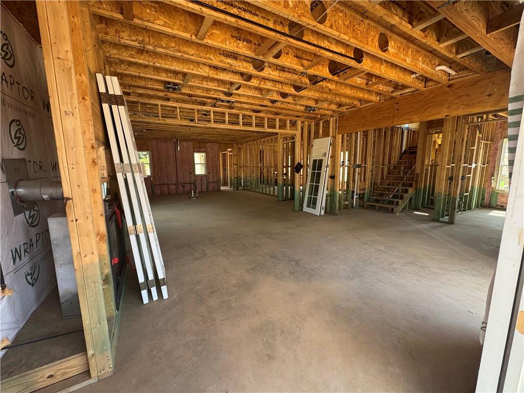 212 Suwanee Avenue Northeast Suwanee, GA 30024 - Photo 6 of 14 a view of an empty room with wooden walls