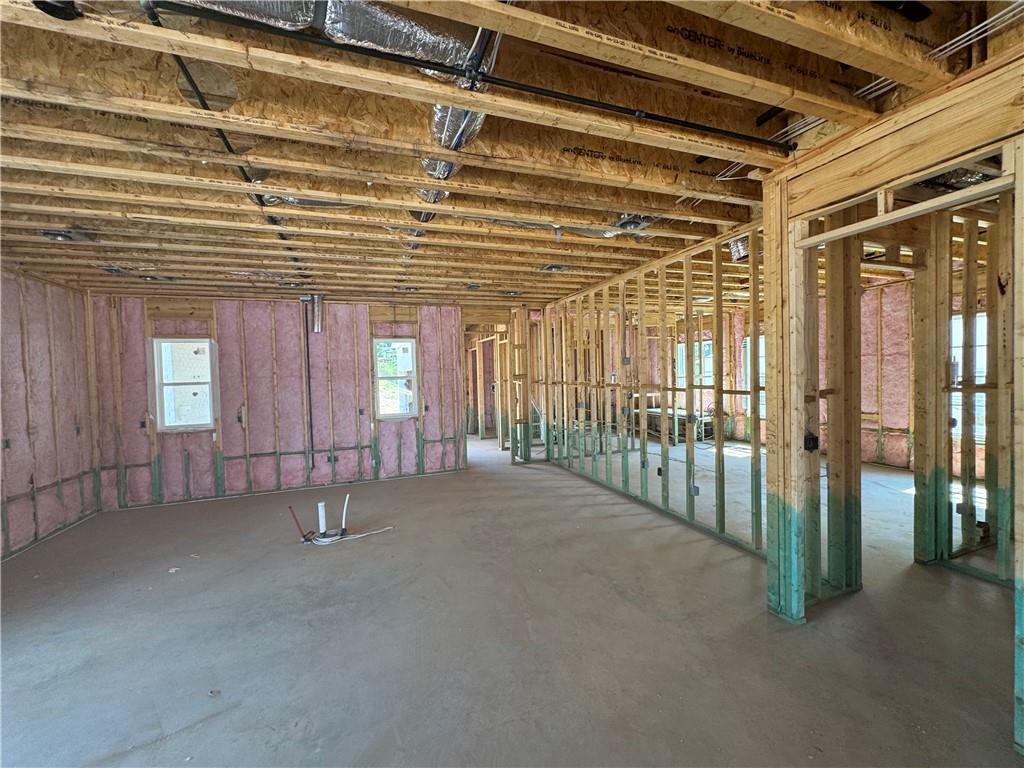 212 Suwanee Avenue Northeast Suwanee, GA 30024 - Photo 8 of 14 a view of a room with wooden floor