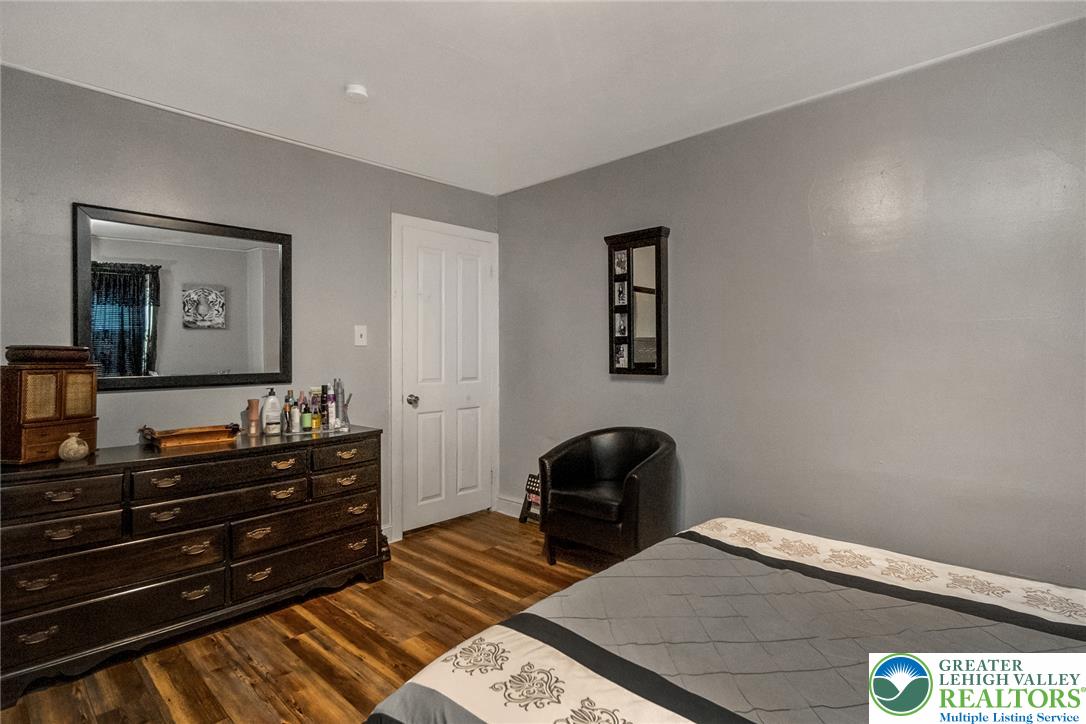 365 Rock Street Easton, PA 18042 - Photo 25 of 50 Hardwood-style flooring and light grey walls define this comfortable bedroom space.