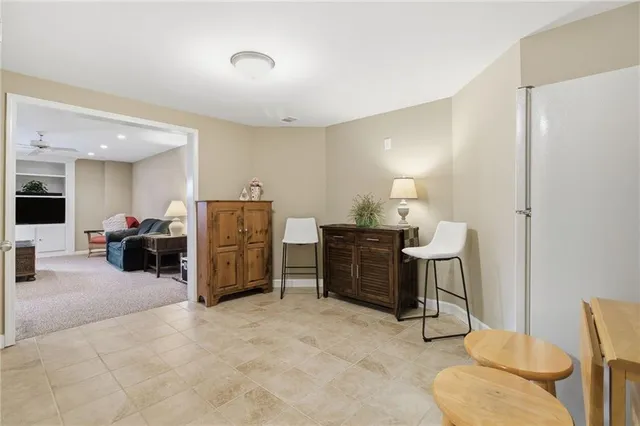 a bed room with furniture and a lamp