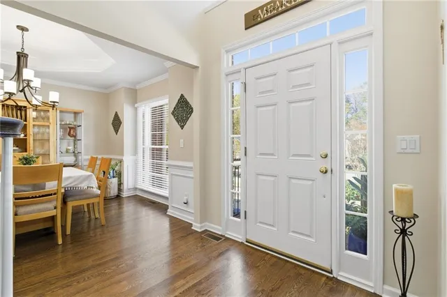 a view of a livingroom with furniture and hardwood floor