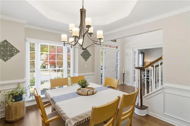 a view of a dining room with furniture window and wooden floor