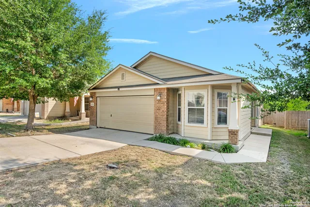 a view of a livingroom with a ceiling fan and window