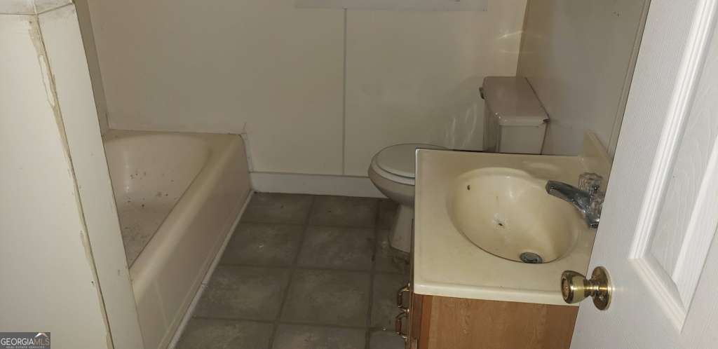 1219 Clough Street Waycross, GA 31501 - Photo 6 of 10 a bathroom with a sink and toilet