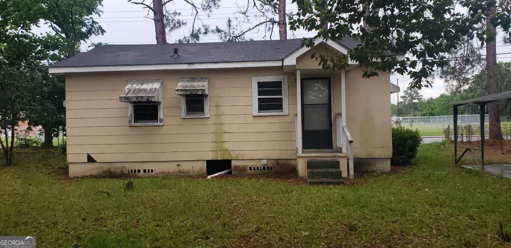 1219 Clough Street Waycross, GA 31501 - Photo 10 of 10 a front view of a house with a garden