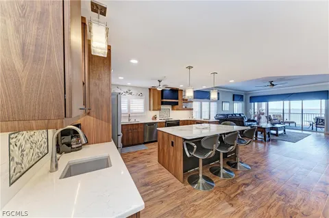 a kitchen with a table chairs stove and cabinets