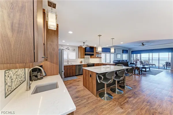 a kitchen with a table chairs stove and cabinets