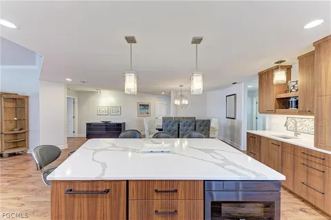 a large kitchen with a table and chairs
