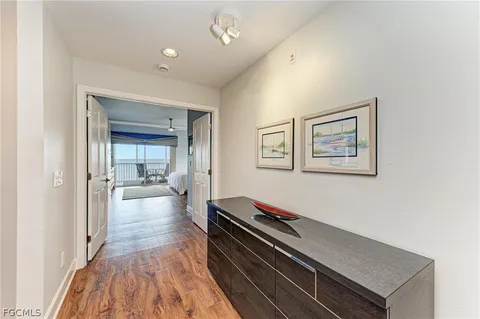 a hallway with a large mirror on a dresser
