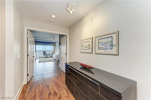a hallway with a large mirror on a dresser