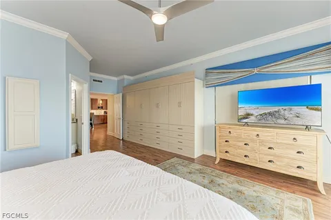 a bedroom with a bed and a dresser