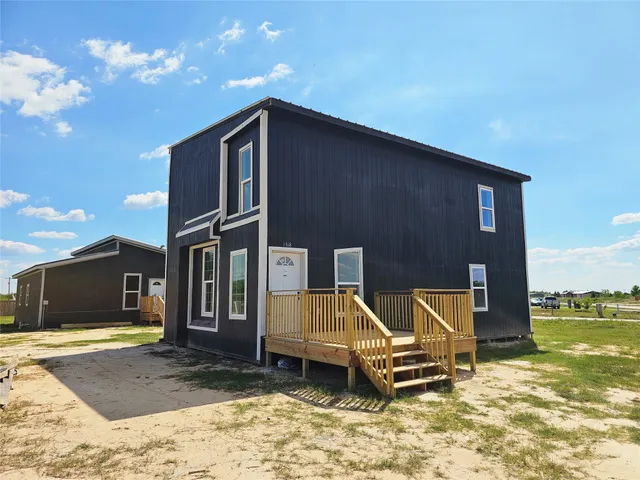 a house view with a backyard space
