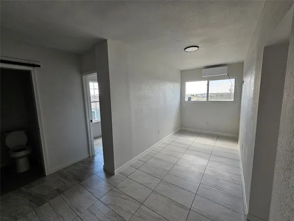 a view of an empty room and window
