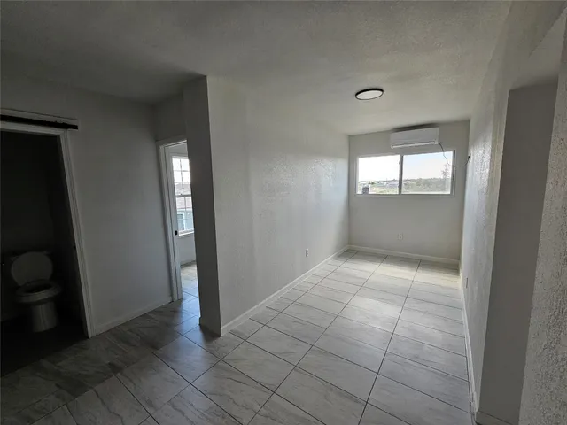 a view of an empty room and window