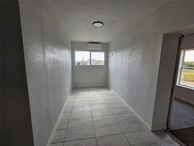 a view of hallway with wooden floor