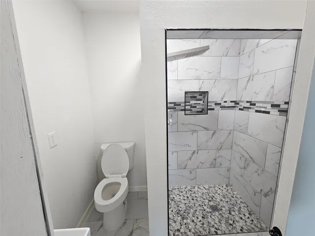 a bathroom with a sink and toilet