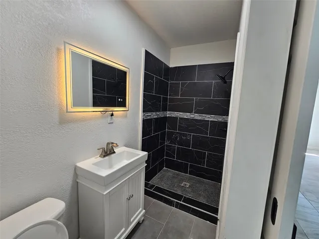 a house view with a backyard space