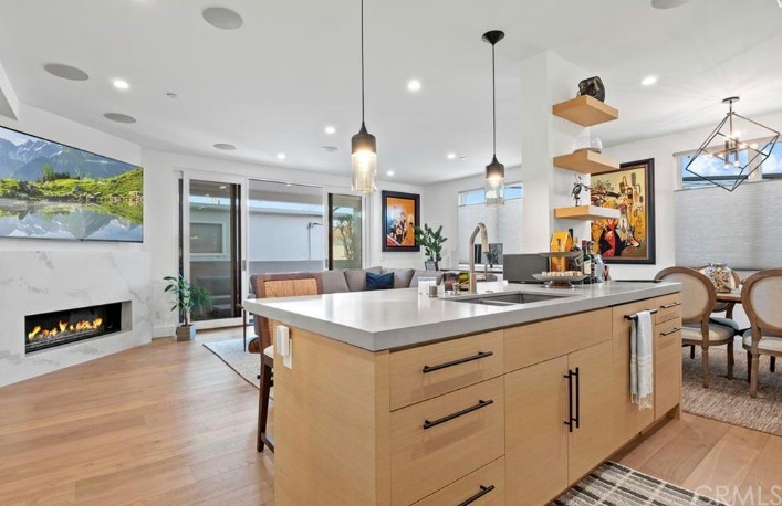 304 Iris Avenue Corona del Mar, CA 92625 - Photo 3 of 19 a kitchen with sink stove and wooden floor