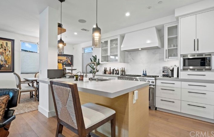 304 Iris Avenue Corona del Mar, CA 92625 - Photo 4 of 19 a kitchen with cabinets a sink and appliances