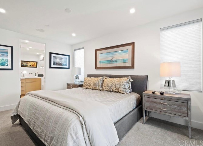 304 Iris Avenue Corona del Mar, CA 92625 - Photo 5 of 19 a bedroom with a bed and a painting on the wall