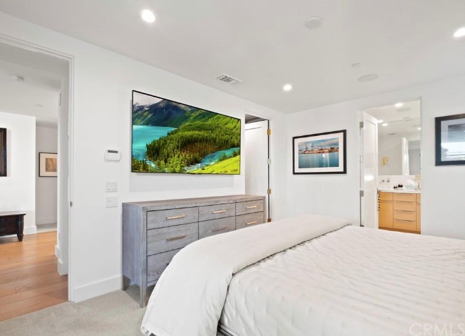 304 Iris Avenue Corona del Mar, CA 92625 - Photo 6 of 19 a bedroom with a bed and a flat screen tv