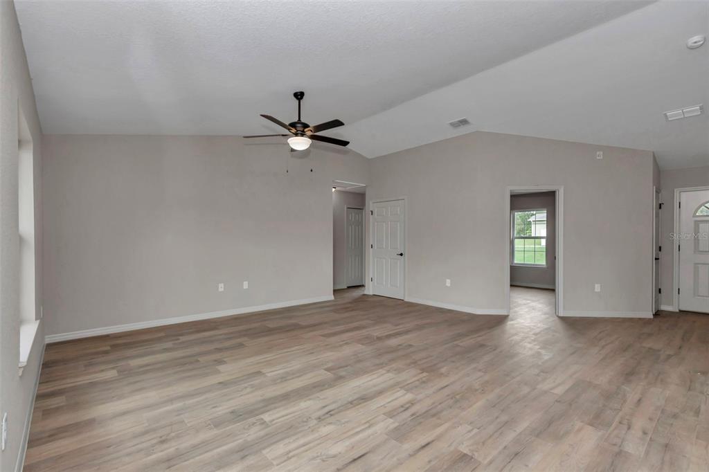21 Pine Course Pass Ocala, FL 34472 - Photo 24 of 29 a view of an empty room with window and wooden floor