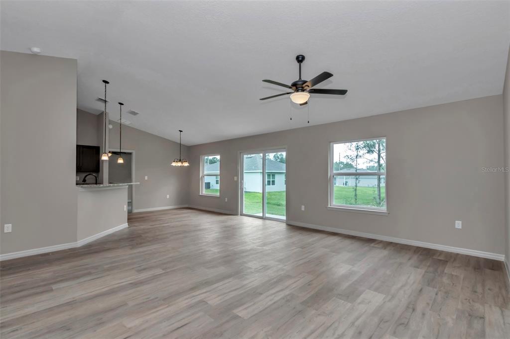 21 Pine Course Pass Ocala, FL 34472 - Photo 26 of 29 a view of an empty room with a window and wooden floor