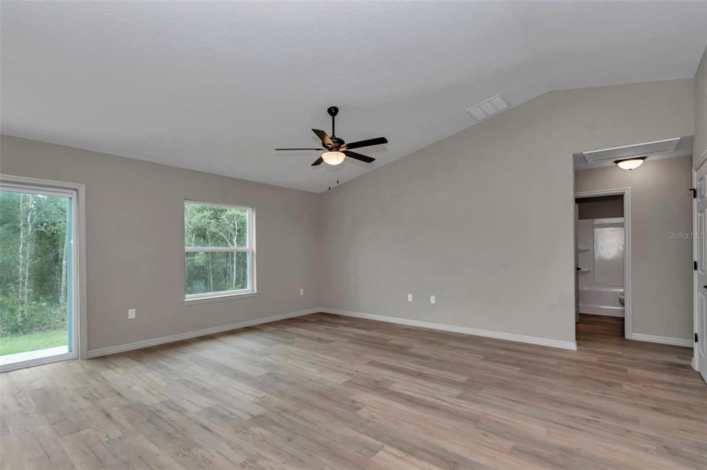 21 Pine Course Pass Ocala, FL 34472 - Photo 27 of 29 wooden floor in an empty room with a window