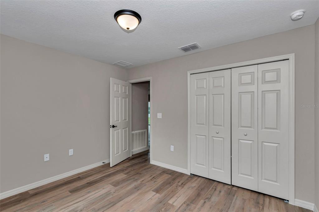 21 Pine Course Pass Ocala, FL 34472 - Photo 4 of 29 a view of an empty room and wooden floor