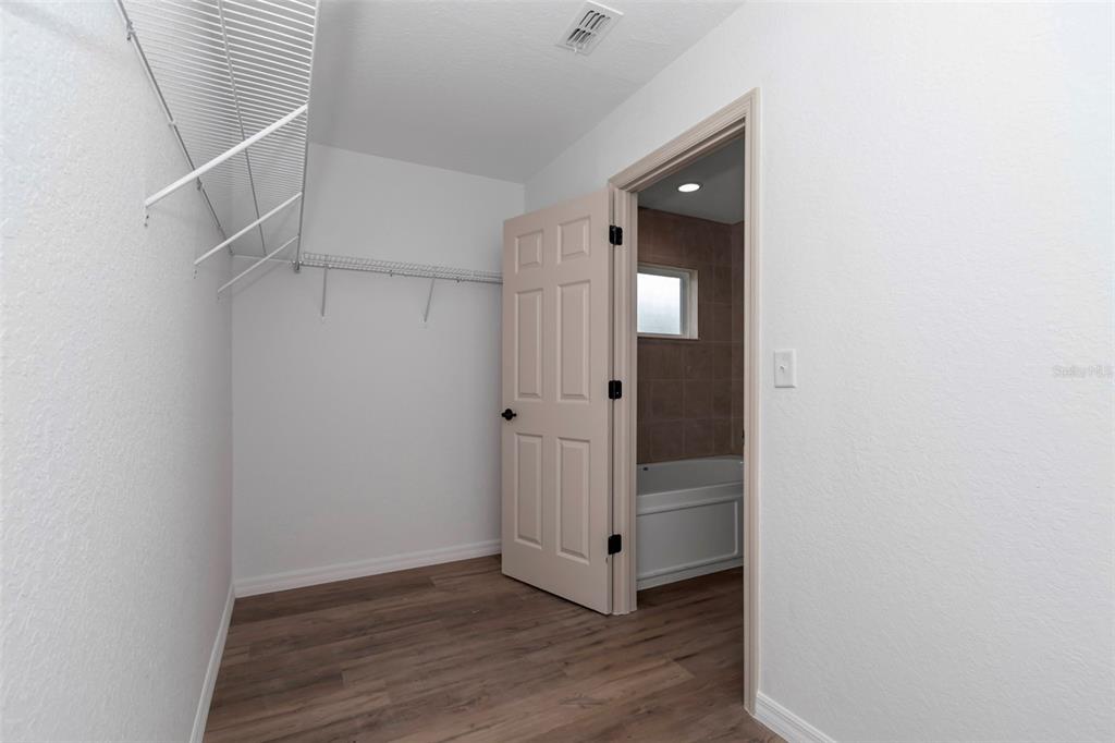 21 Pine Course Pass Ocala, FL 34472 - Photo 8 of 29 a view of a hallway with wooden floor