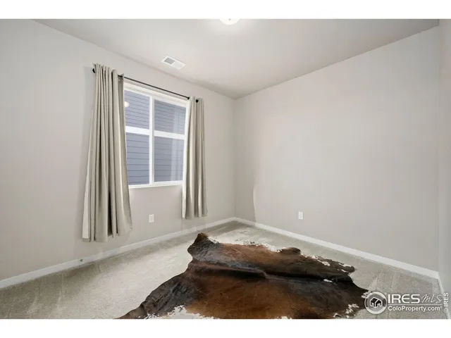 view of an empty room with a window