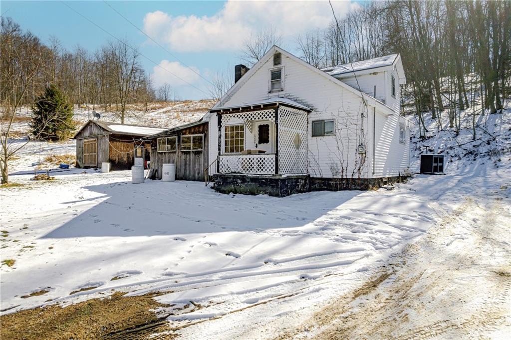 1249 Ridge Road Templeton, PA 16259 - Photo 2 of 37 a front view of a house with a yard