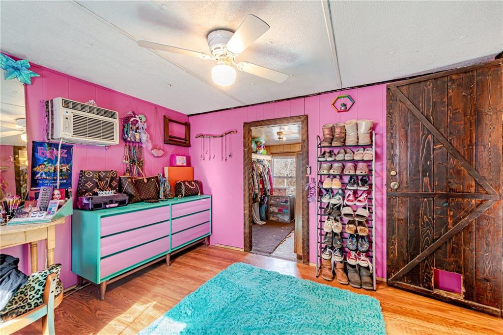 1249 Ridge Road Templeton, PA 16259 - Photo 23 of 37 a room with lots of books and white walls