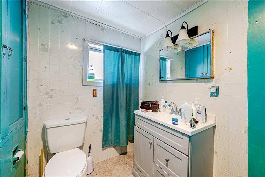 1249 Ridge Road Templeton, PA 16259 - Photo 26 of 37 a bathroom with a sink a toilet and shower