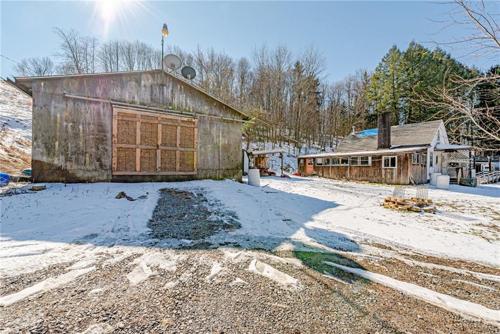 1249 Ridge Road Templeton, PA 16259 - Photo 5 of 37 a view of a house with snow on the road