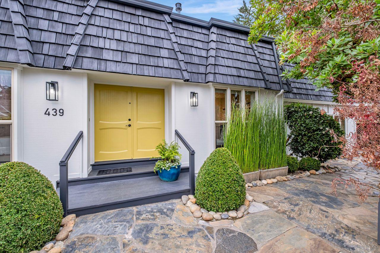 a front view of a house with garden
