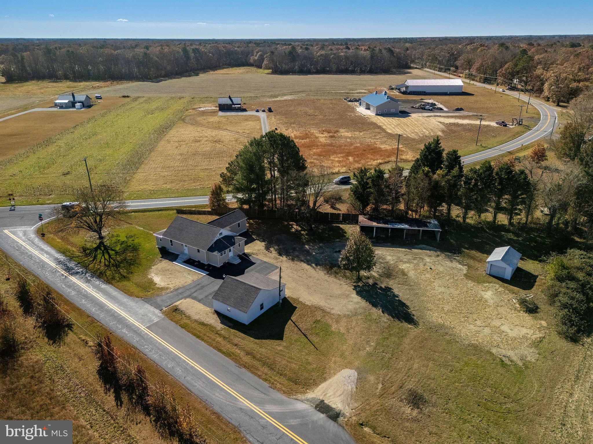 a view of a swimming pool with a patio and a yard