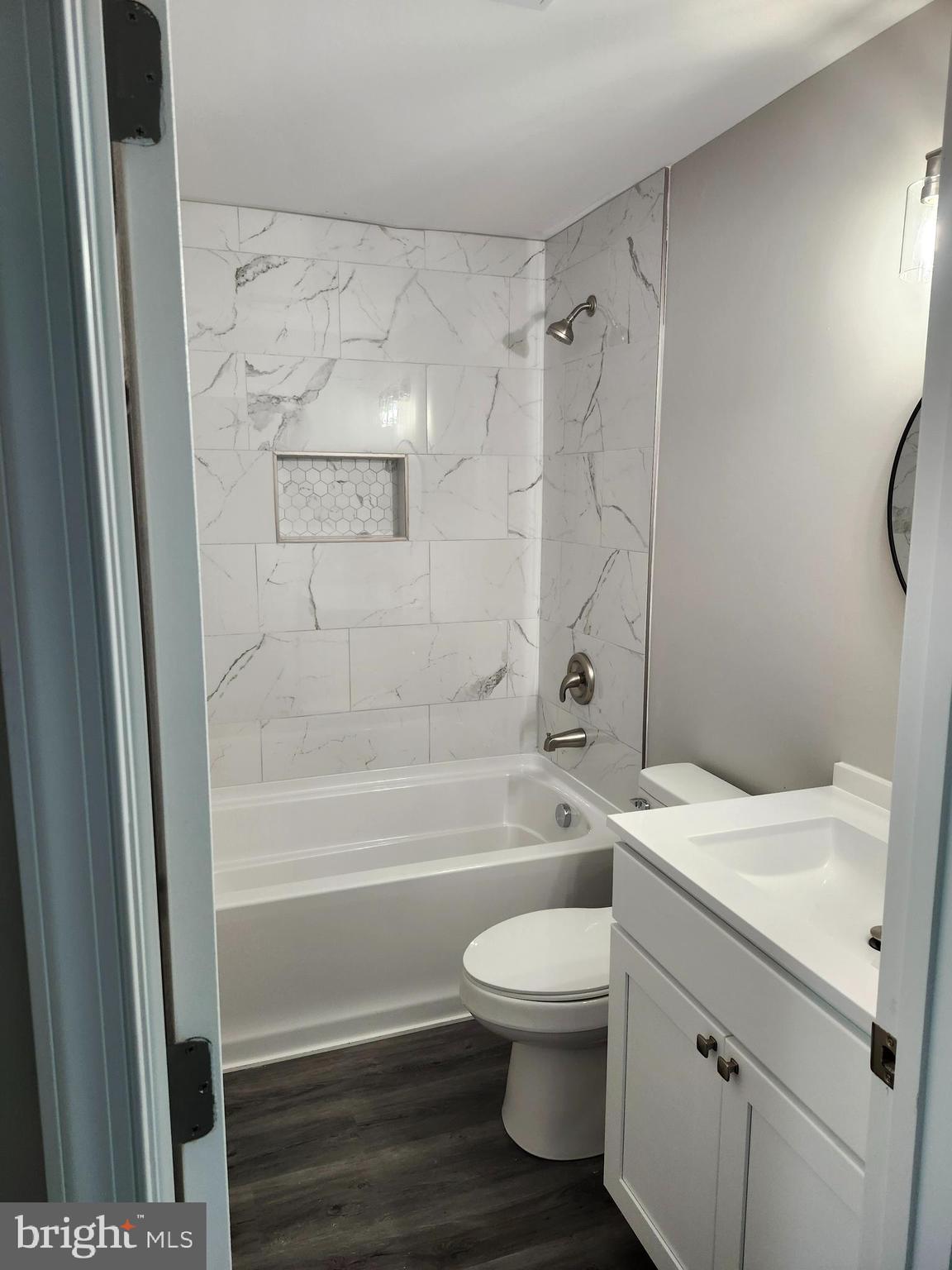 24532 Deep Branch Road Georgetown, DE 19947 - Photo 11 of 43 a bathroom with a sink a toilet and a bathtub