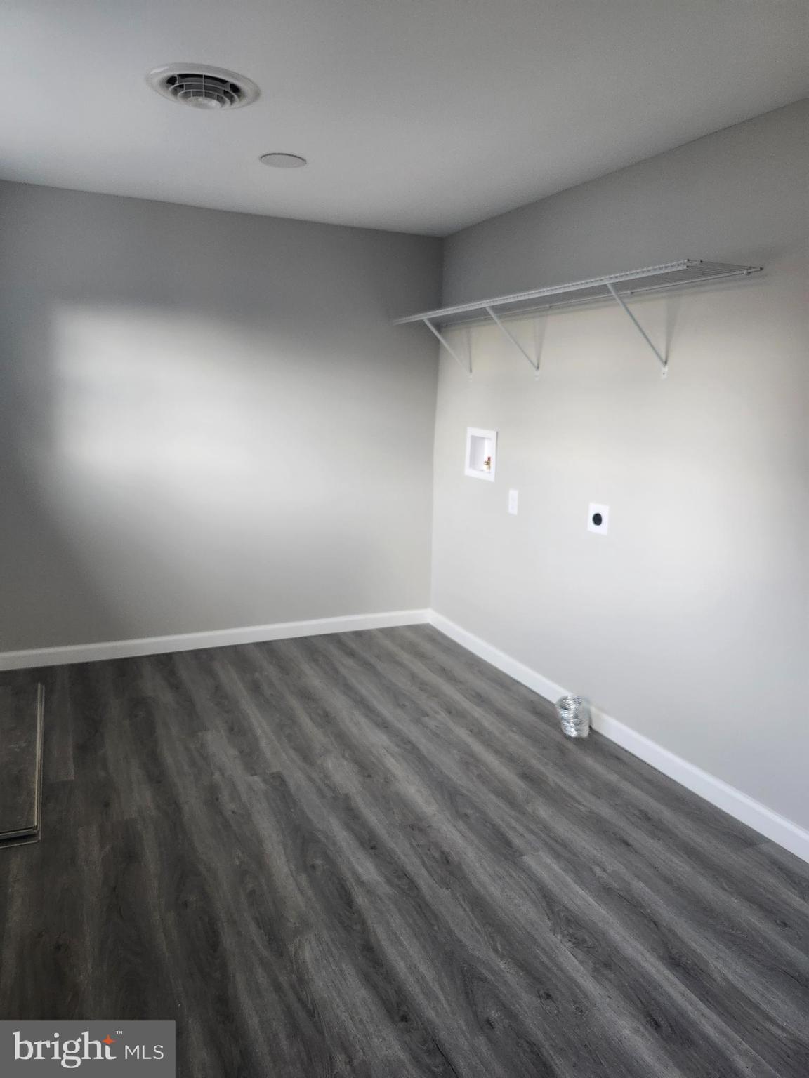 24532 Deep Branch Road Georgetown, DE 19947 - Photo 12 of 43 a view of an empty room with wooden floor