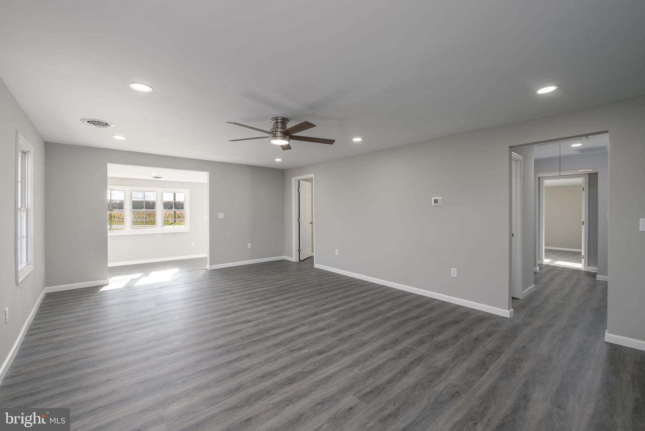 24532 Deep Branch Road Georgetown, DE 19947 - Photo 17 of 43 a view of an empty room with window and wooden floor